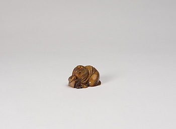 A Japanese Ivory Carved Netsuke of a Tanuki, 19th Century by  Japanese Art