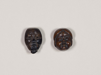 Two Japanese Boxwood Carved Mask Netsuke, 19th Century by  Japanese Art