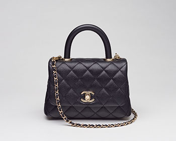 A BLACK QUILTED CAVIAR LEATHER MINI COCO HANDLE WITH LIGHT GOLD HARDWARE by  CHANEL sold for $9,375