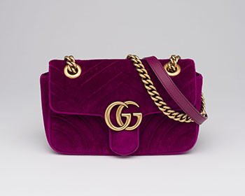 A PURPLE VELVET GG MARMONT FLAP BAG by  GUCCI sold for $1,250