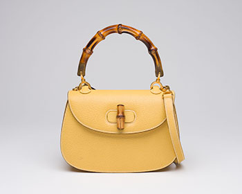 A VINTAGE BAMBOO 1947 TOP HANDLE BAG by  GUCCI sold for $2,500