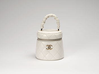 A WHITE QUILTED LAMBSKIN RUCHED HANDLE VANITY CASE by  CHANEL sold for $1,500