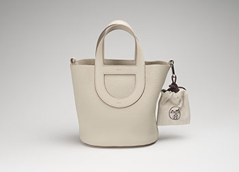 A BETON TAURILLON CLEMENCE IN THE LOOP 18 WITH PALLADIUM HARDWARE by  HERMÈS sold for $5,000