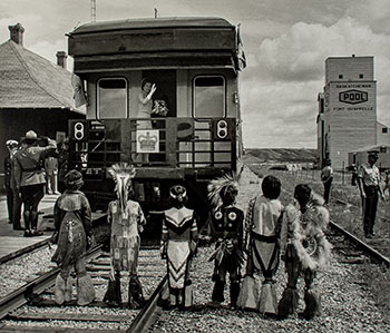 The Queen waves to children from the back of her train as she and the Duke of Edinburgh depart Fort Qu’Appelle, Saskatchewan, July 29, 1978 by Doug Ball sold for $1,625