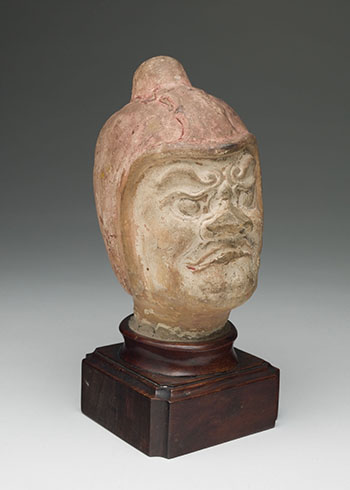 Chinese Painted Earthenware Head of a Guardian, Tang Dynasty (618-907) by  Chinese Art