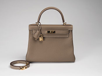 AN ÉTOUPE TOGO LEATHER RETOURNÉ KELLY 28 WITH GOLD HARDWARE by  HERMÈS