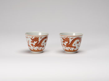 A Pair of Chinese Iron Red ‘Dragon’ Wine Cups, Guangxu Mark and Period (1875-1908) by  Chinese Art