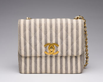 A VINTAGE WHITE & GREY STRIPED CANVAS SQUARE FLAP BAG by  CHANEL