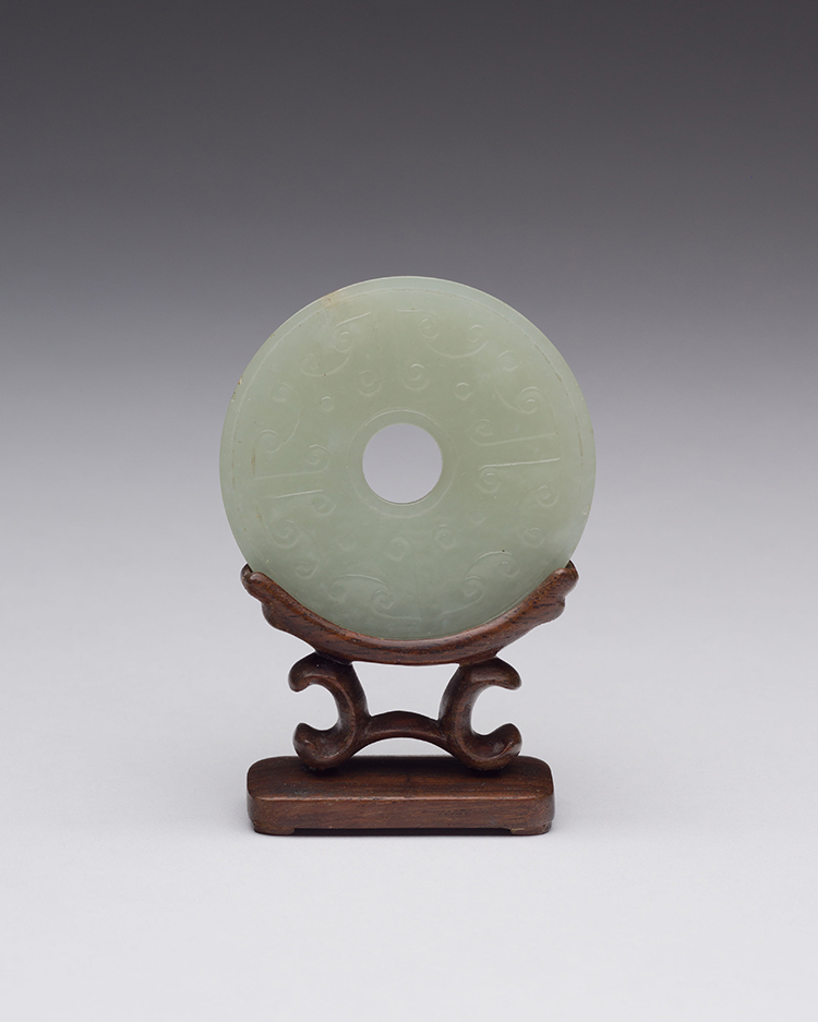 A Chinese Pale Celadon Carved Bi Disc, 19th Century par  Chinese Art