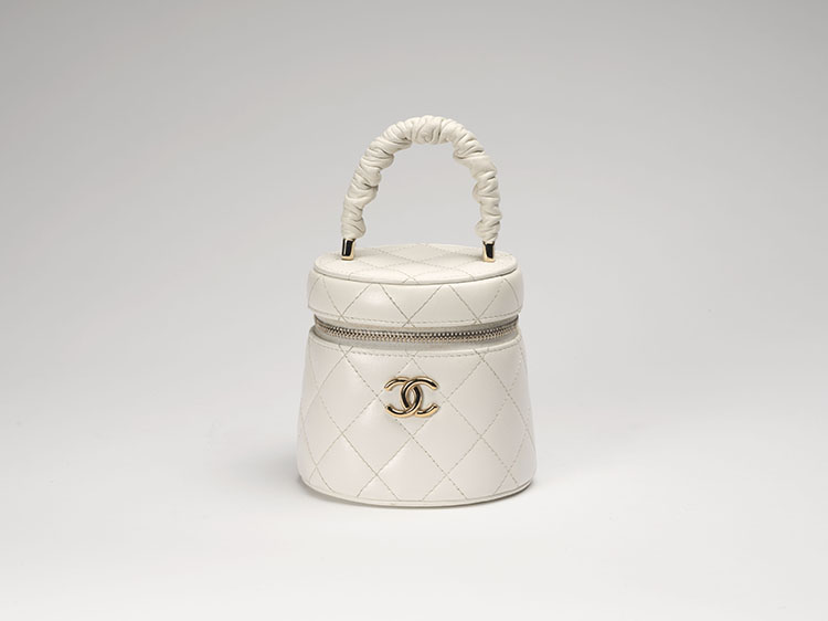 A WHITE QUILTED LAMBSKIN RUCHED HANDLE VANITY CASE by  CHANEL