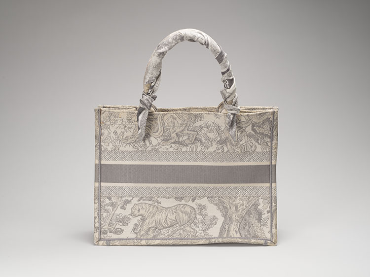 A GRAY AND ECRU TOILE DE JOUY EMBROIDERY CANVAS BOOK TOTE WITH A DIOR WHITE AND GREY TWILLY by  DIOR