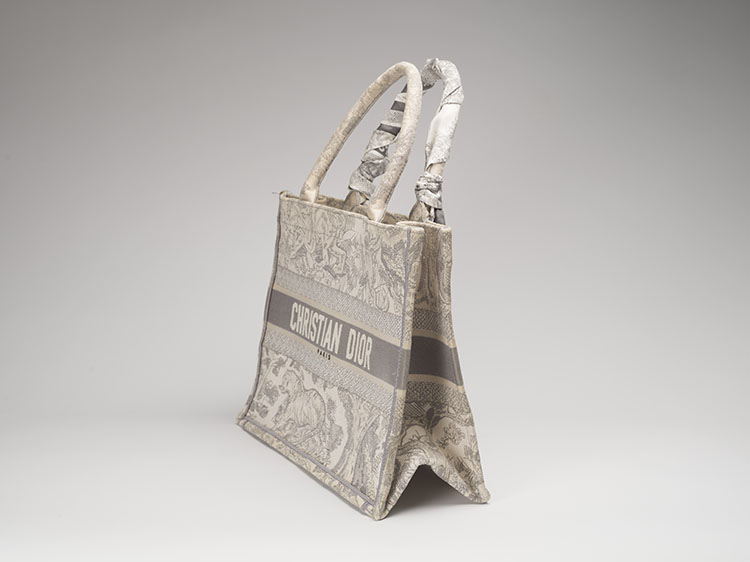 A GRAY AND ECRU TOILE DE JOUY EMBROIDERY CANVAS BOOK TOTE WITH A DIOR WHITE AND GREY TWILLY by  DIOR