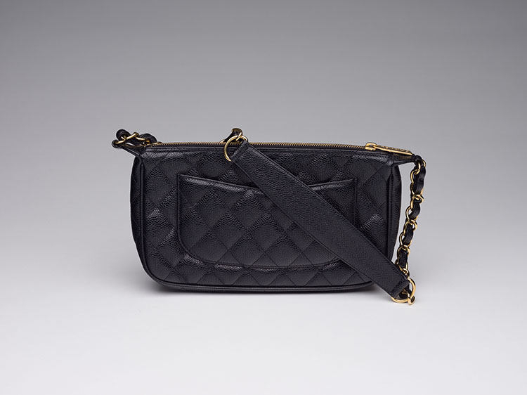 A BLACK QUILTED CAVIAR LEATHER TIMELESS CC POCHETTE WITH GOLD HARDWARE by  CHANEL