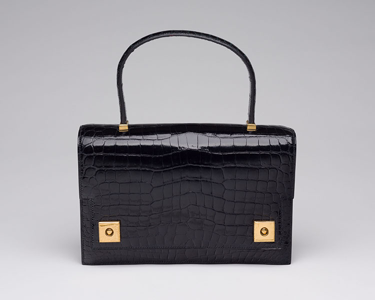 A VINTAGE BLACK POROSUS CROCODILE PIANO BAG WITH GOLD HARDWARE by  HERMÈS