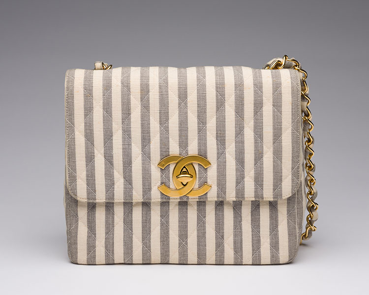 A VINTAGE WHITE & GREY STRIPED CANVAS SQUARE FLAP BAG by  CHANEL